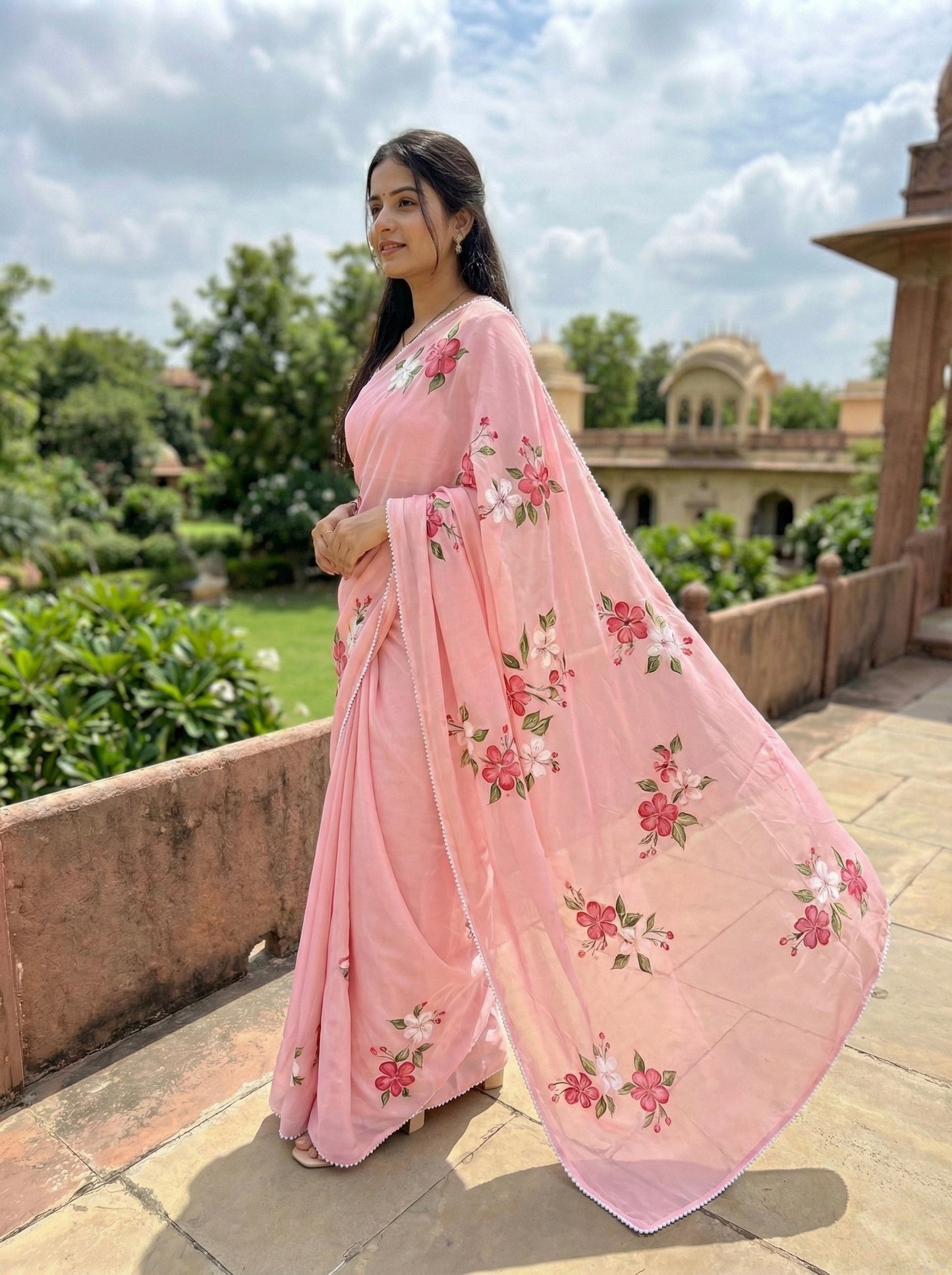 Baby Pink Handpainted Crape silk Saree Enhanced with handwork