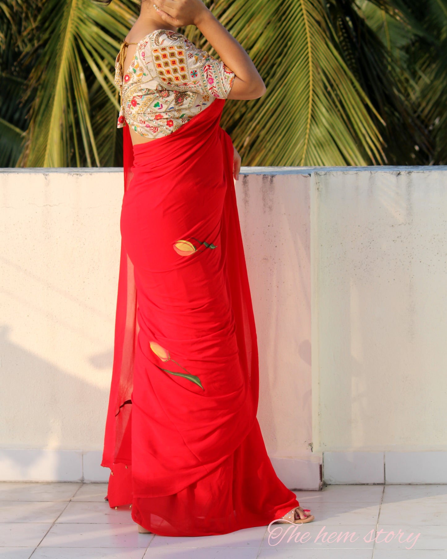CHITRAKARI- red tulip handpainted saree paired with off white embellished blouse