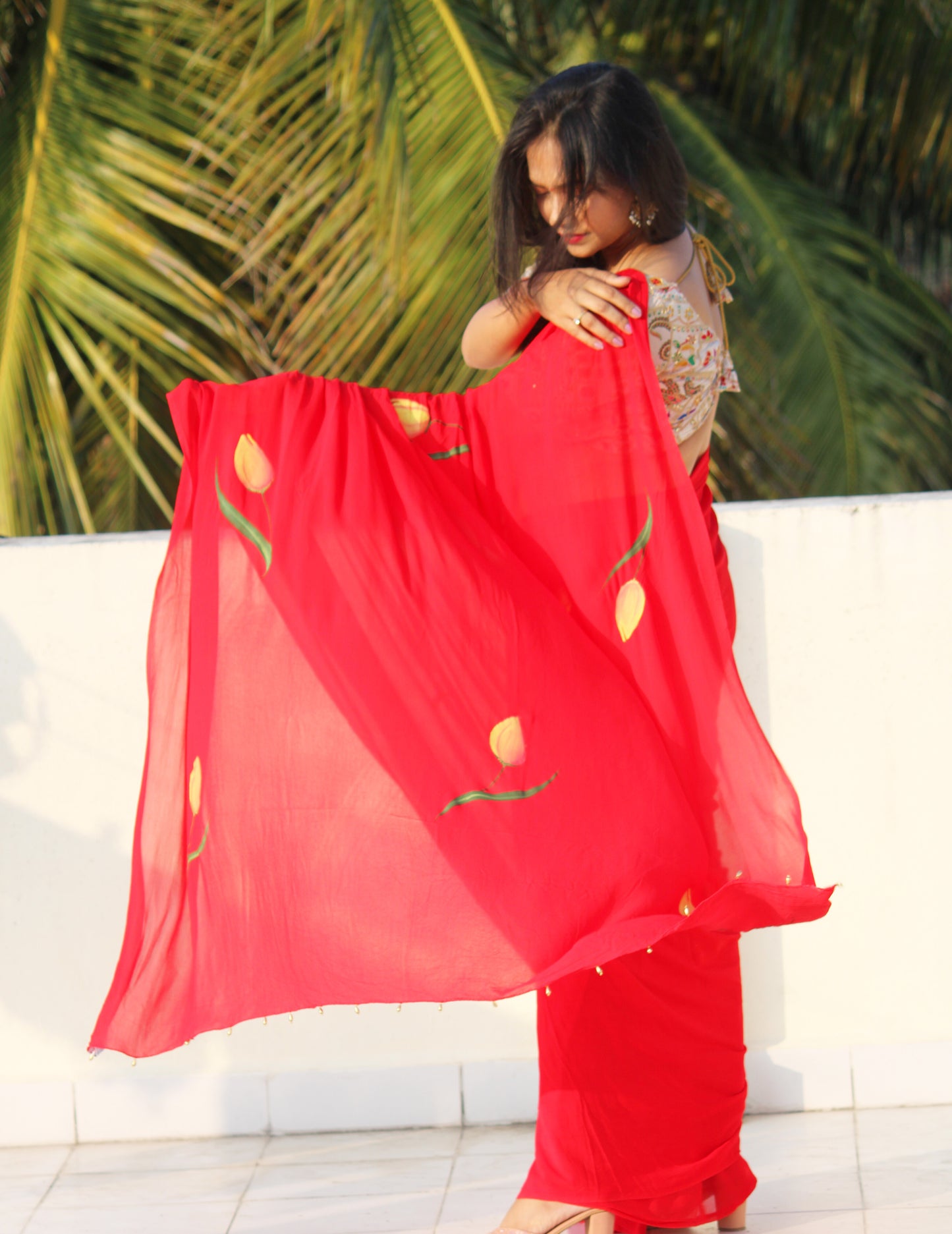 CHITRAKARI- red tulip handpainted saree paired with off white embellished blouse