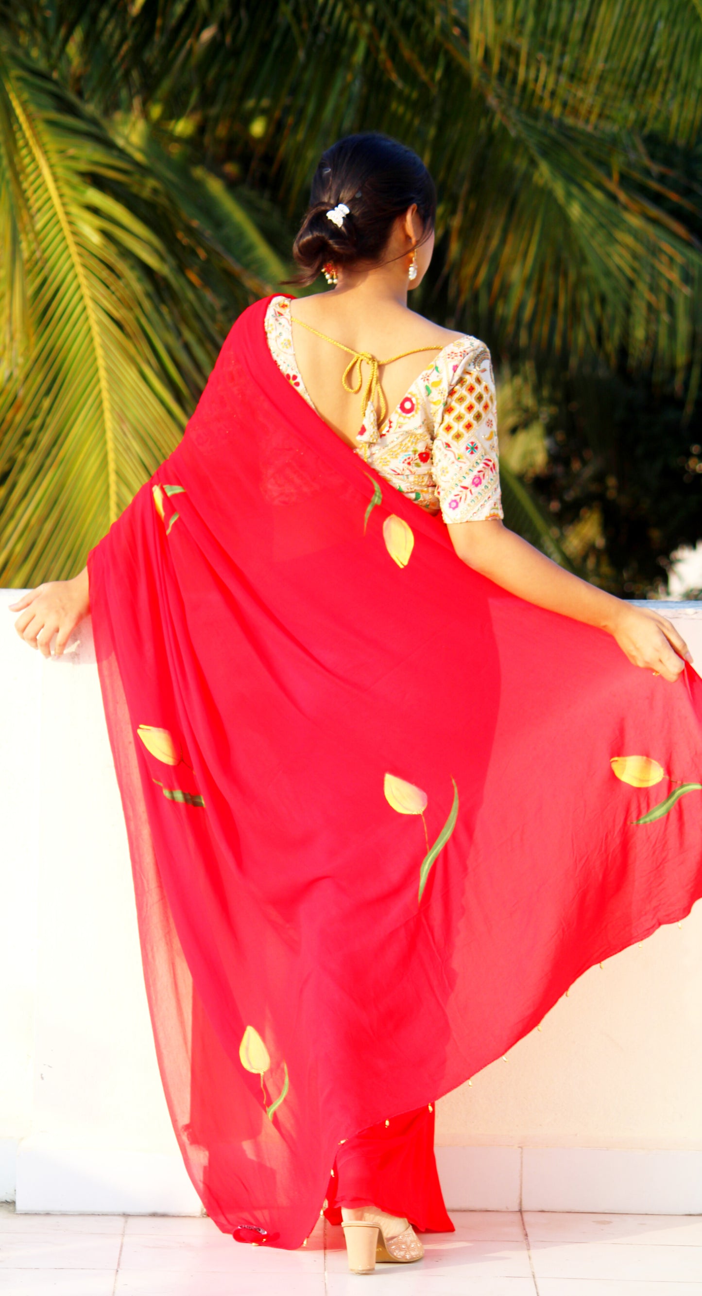 CHITRAKARI- red tulip handpainted saree paired with off white embellished blouse